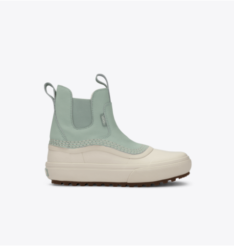 Light green and beige boot on a white background