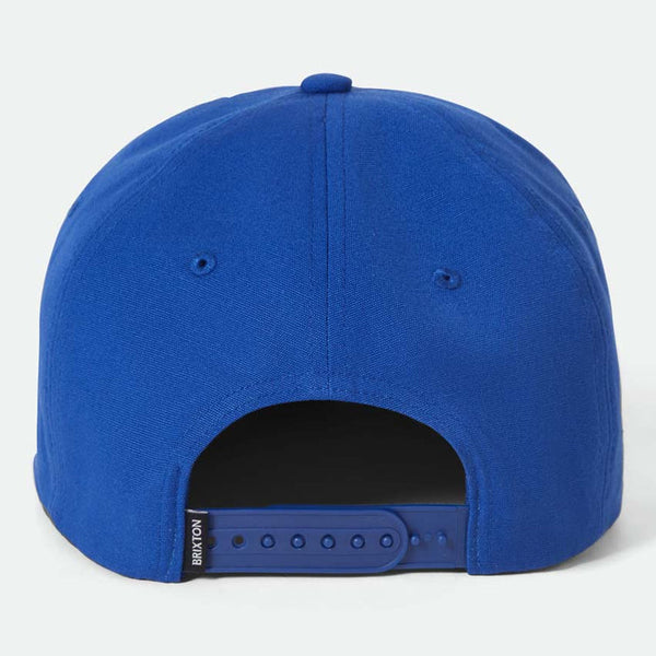 Blue cap with a brand logo on the back against a white background